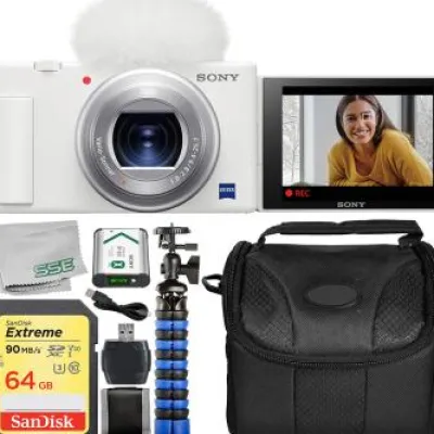 Discount Sony ZV-1 Digital Camera (White) With Starter Vlogging Kit. Includes: 64GB Extreme Memory Card, Wind Screen, Wind Screen Adapter, NP-BX1/M8 Rechargeable Lithium-Ion Battery (3.6V, 1240mAh), 12†Gripster Tripod, & More.